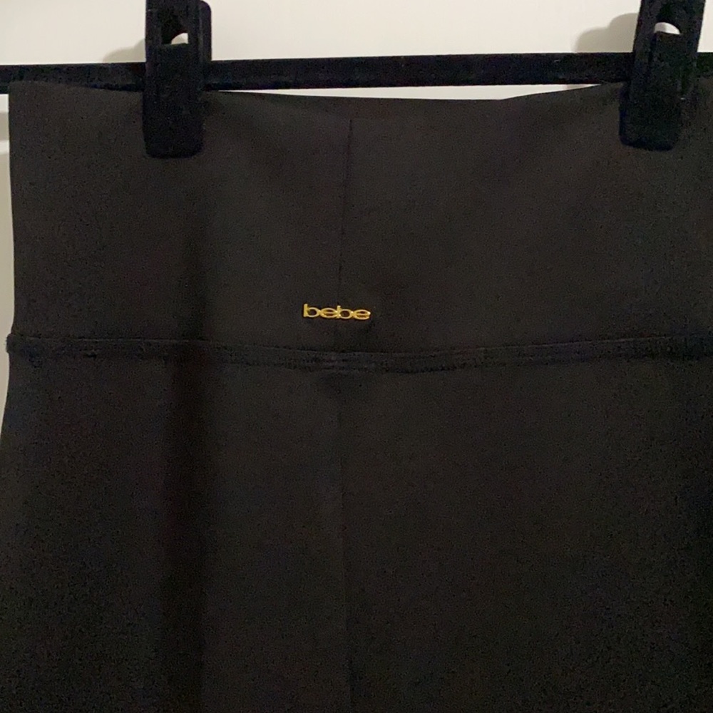 NWOT. Bebe black midi length skirt. Never worn. - Picture 5 of 6